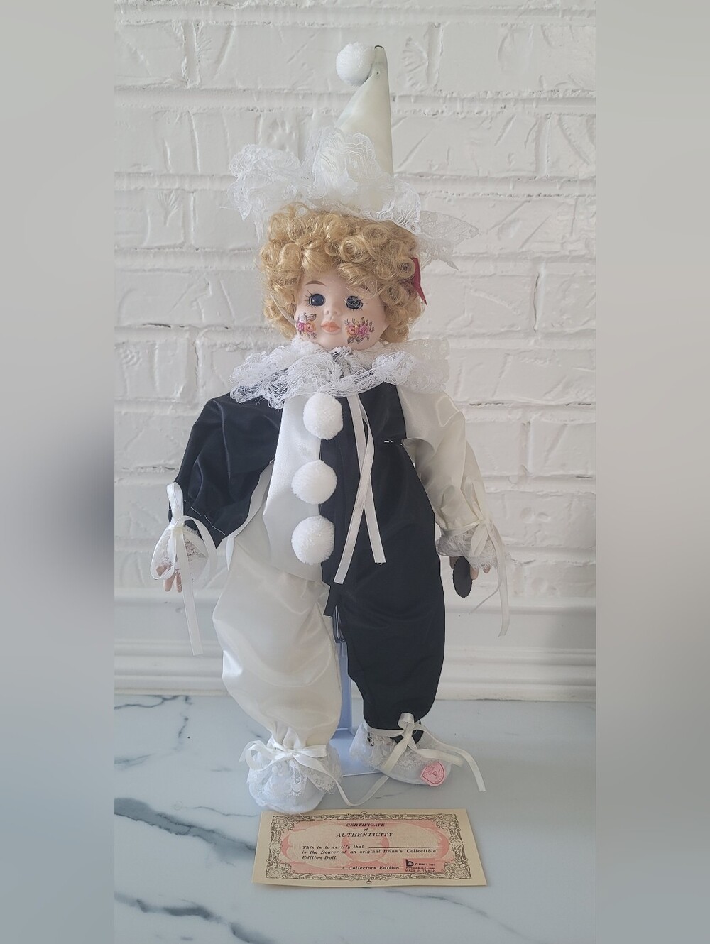 Classic Black and White Porcelain Clown Doll with Lace Accents